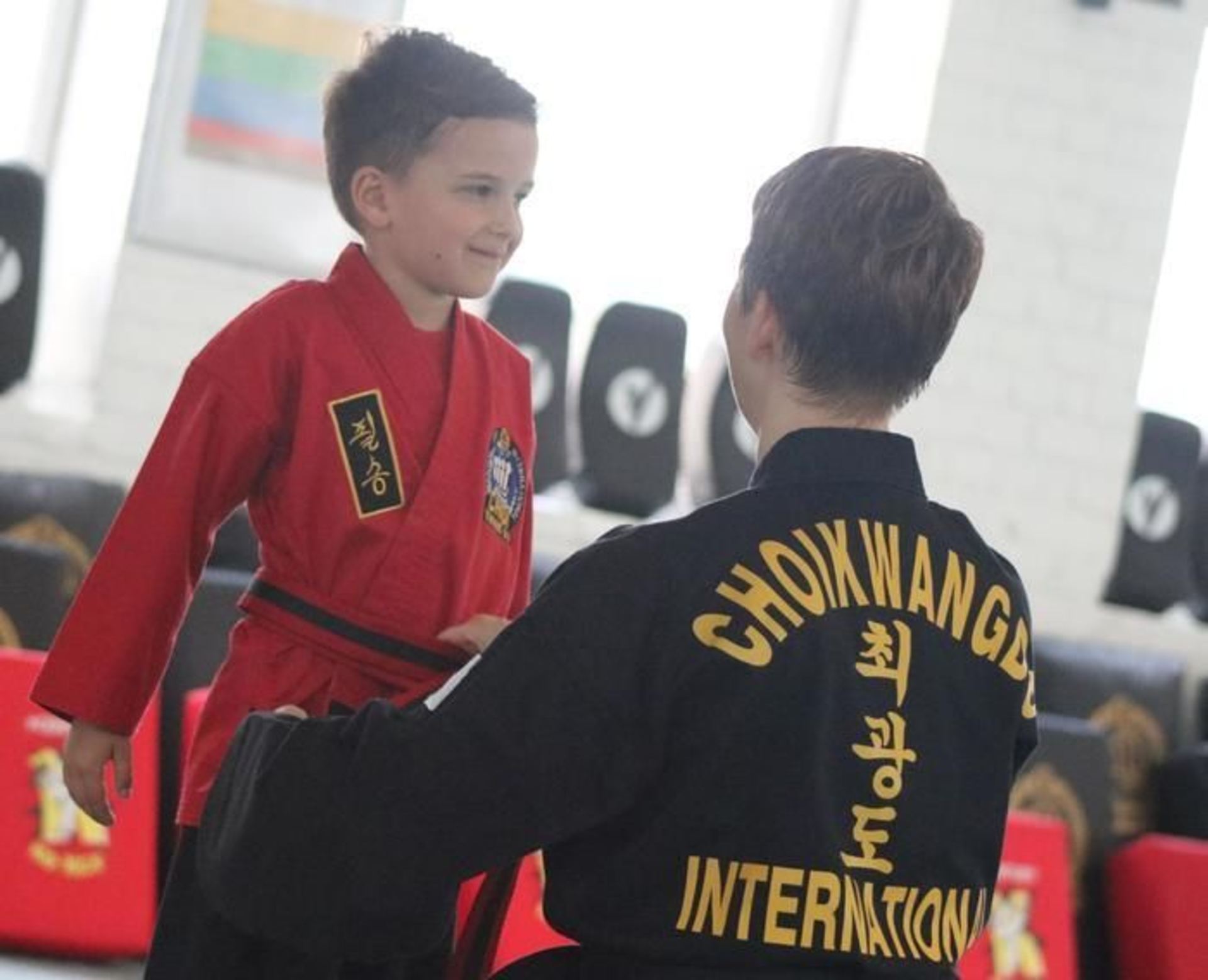 Children interacting in training hall