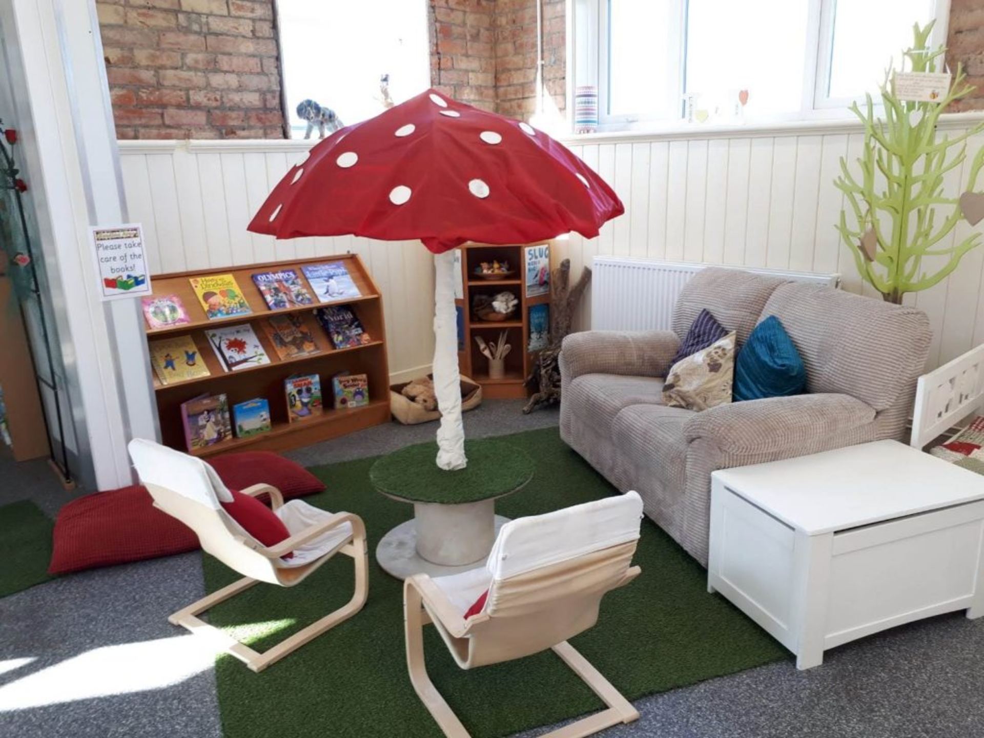 Reading corner with mushroom canopy, books and cushions